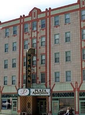 A historic multi-story brick building on a small-town main street